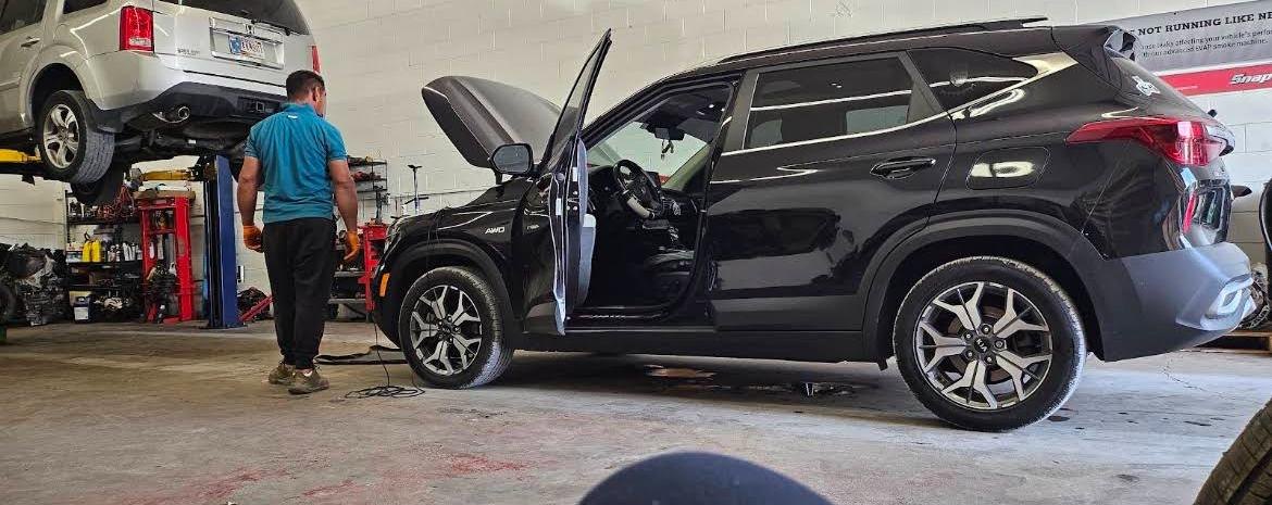 Patrick's wife's SUV being repaired in the shop