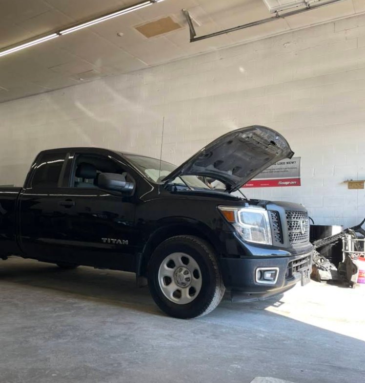 A Nissan Titan pickup in the shop for diagnostic testing